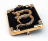 erte brooch letter B